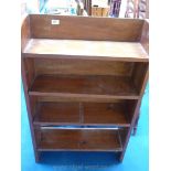 A Mahogany four-shelved bookcase.