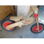 'My first bike', wooden with no pedals.