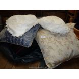 A bag of miscellaneous cushions.