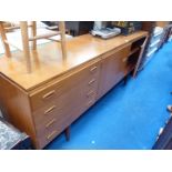 A large wooden sideboard with drawers and shelves, 78" long x 18" wide.