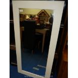 An Ikea wall mirror with painted white surround 46 1/2" tall x 23".