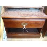 A dark wood TV table with drawer.