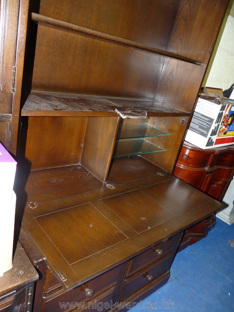 An Ercol dark-wood dresser with drinks compartment shelving and six drawers. - Image 3 of 3