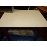 A Formica topped kitchen table with drawer.