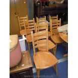 Seven sturdy Elm & Beech ladder-back kitchen chairs.