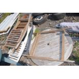 Five wooden folding deck chairs style patio chairs and a table.