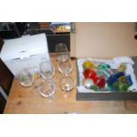A box of Dartington crystal mixed wine glasses and perspex sculpture