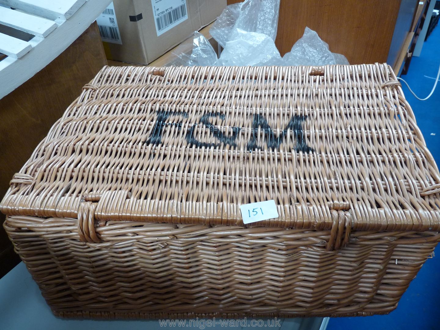 A Fortnum and Mason wicker basket and contents including Steam Loco bookends, etc.
