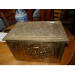 A brass coal box.