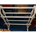 A white painted towel rail.