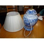 A blue and white lamp and shade.