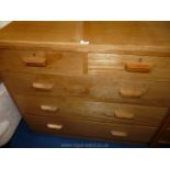 A light Oak chest of three long and two short drawers, 42" long x 19" wide x 38" tall.