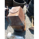 An old Villager wood burner with stainless steel flue piece.