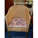 A wicker commode chair.