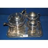 A three piece plated Teaset on square tray.