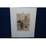 A framed etching of Durham Cathedral by Oswald Fletcher.