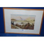 A framed Watercolour depicting a valley landscape with lake and rolling mountains in the distance,