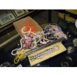 Miscellaneous costume jewellery including bead necklaces and clip-on earrings.