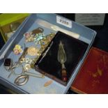 A small quantity of costume jewellery including brooches, key ring,