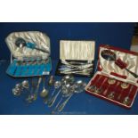 A quantity of plated and metal cutlery including fruit spoons, fish eaters etc, some cased.