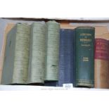 Seven old medical books.