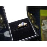 An 18 ct sapphire and diamond ring hallmarked size 'N 1/2'.