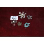 Four costume jewellery brooches including, Tortoise set with turquoise stones, filigree metal bow,