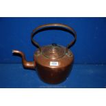 A Victorian copper kettle.