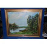 A framed oil on canvas of a river scene with woodland and a path, unsigned. 27 1/2" x 21 1/2".
