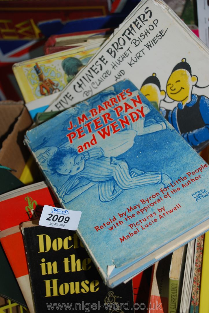 A crate of various books to include The Five Chinese Brothers, Peter Pan and Wendy by J.M.