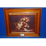 A wooden framed Oil on canvas still life depicting a vase of flowers, signed C.A.