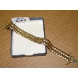 A 9ct marked gold double row chevron bracelet, 185 mm long approximately and with safety fastenings,