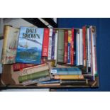 A box of books including Dale Brown, Michael Jackson's Beer etc.