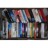 A quantity of paperbacks including Dale Brown, Pablo's War, James Herbert etc.