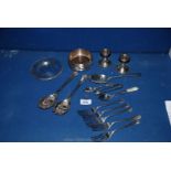 A quantity of silver plate including wine bottle coaster, candlestick, spoons, etc.