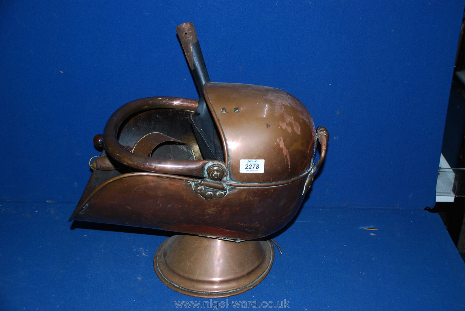 A Copper helmet Coal Scuttle and two copper scoops