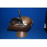 A Copper helmet Coal Scuttle and two copper scoops