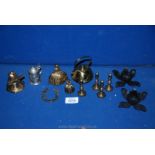 A small quantity of brass ornaments to include; small candlesticks, Welsh lady bell, windmill, etc.