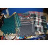 Five Tartan travel rugs in grey, greens and blues,