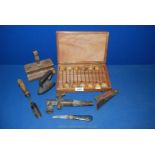 A small box of miscellanea including small flat iron, wood plane, penknives,