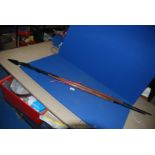 Two ethnic wooden shafted Spears with metal heads and bases, one 54'',