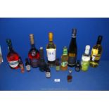 Two bottles of Brandy including Martell and Three Barrells, various wines and miniatures.