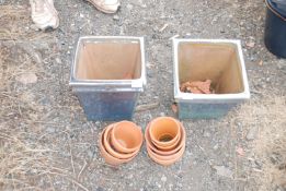 2 x square garden planters and a quantity of clay flowerpots.
