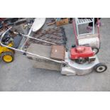 HR216 Honda Mower with roller, (needs attention).