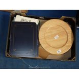 Quantity of wooden platters and place mats.