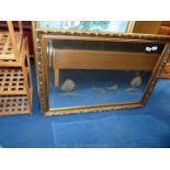 Modern gilt framed bevel edged mirror with horse and trap design, to the glass,