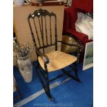 Seagrass seated stick back rocking chair