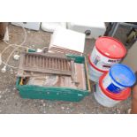 3 x tubs of tile adhesive, quantity of tiles 310 mm square and a cast iron fire grate.