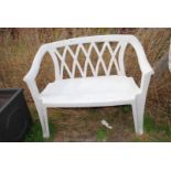 Two seater plastic garden bench.