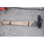 Set of cane drain rods and chimney brush.